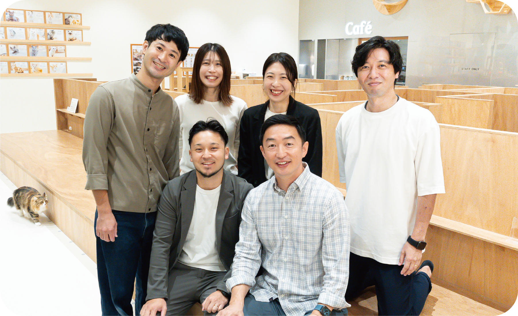 MOFF employees gather with smiles on their faces in this corporate profile image.